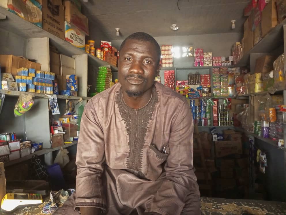 Basiru Hassan in his store. Photograph: Promise Eze